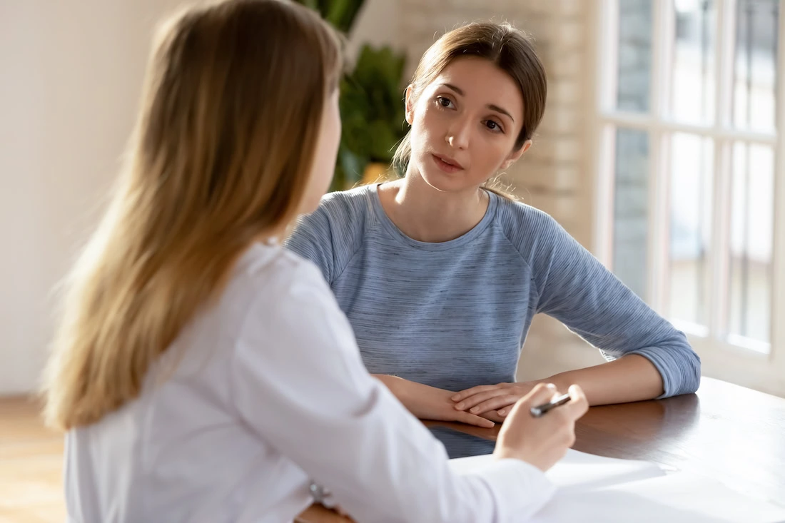 A woman participates in dialectical behavior therapy for PTSD and substance abuse.