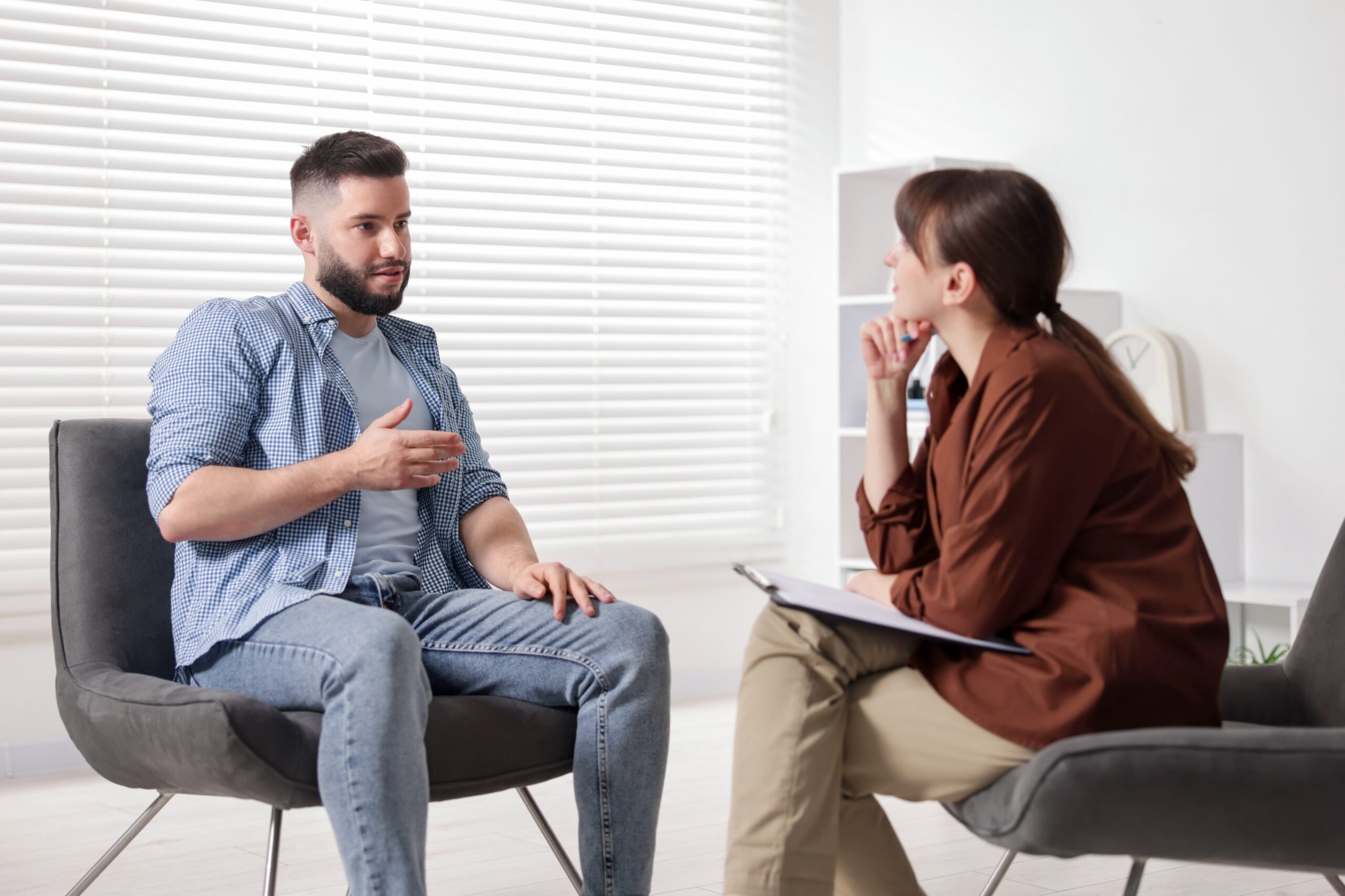 Man talking to a therapist about moral reconation therapy.