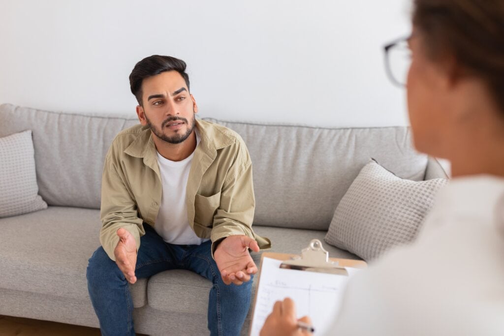 Man talking to drug and alcohol intervention specialist.